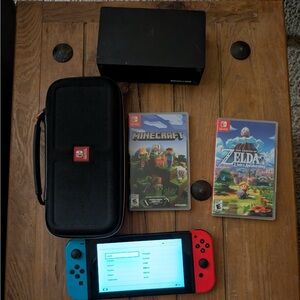 Generation 2 Nintendo Switch, Pre-Owned. Comes with accessories and two games